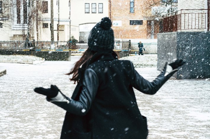 Girl walking in a snow.