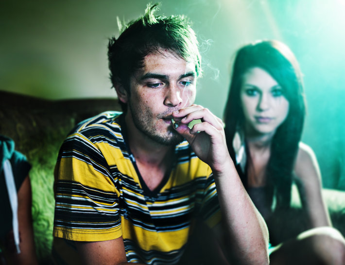 Teen smoking a joint