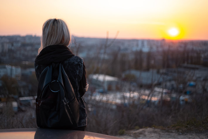 Picture of woman looking at sunrise